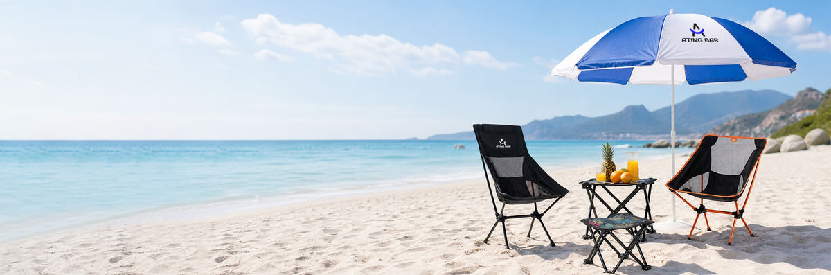 ATING BAR lightweight folding moon chair, backrest camp chair, and sun cap under a beach umbrella by the ocean.